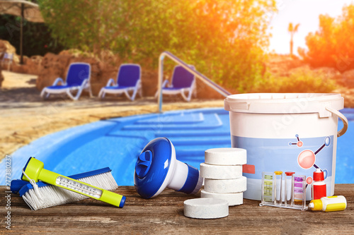 Equipment with chemical cleaning products and tools for the maintenance of the swimming pool. photo