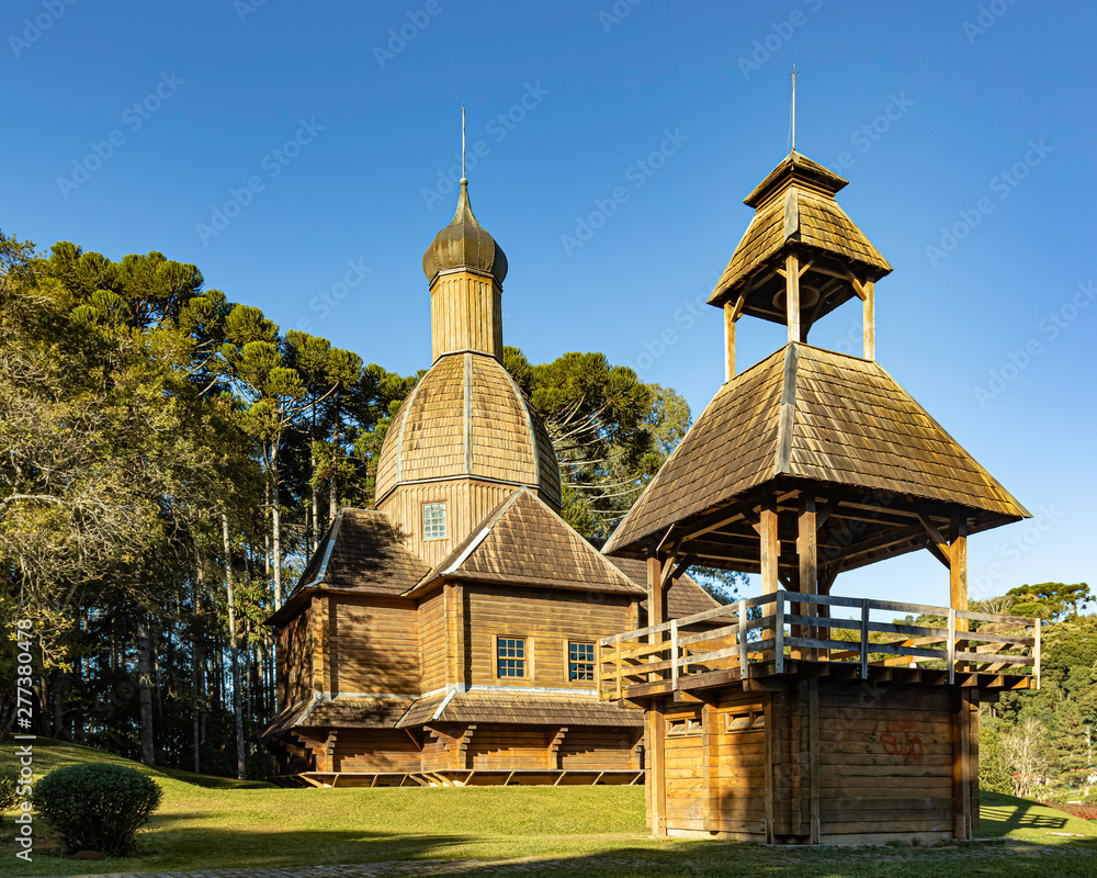 Wooden church in a park on a sunny day