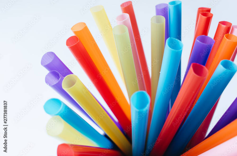 Pile of colorful cocktail straws over white background Pile of colorful cocktail straws over white background