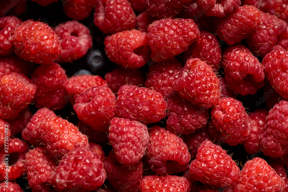 close up view of tasty ripe mixed raspberries and blueberries close up view of tasty ripe mixed raspberries and blueberries