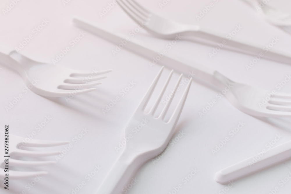 White plastic forks flat lay on white background White plastic forks flat lay on white background