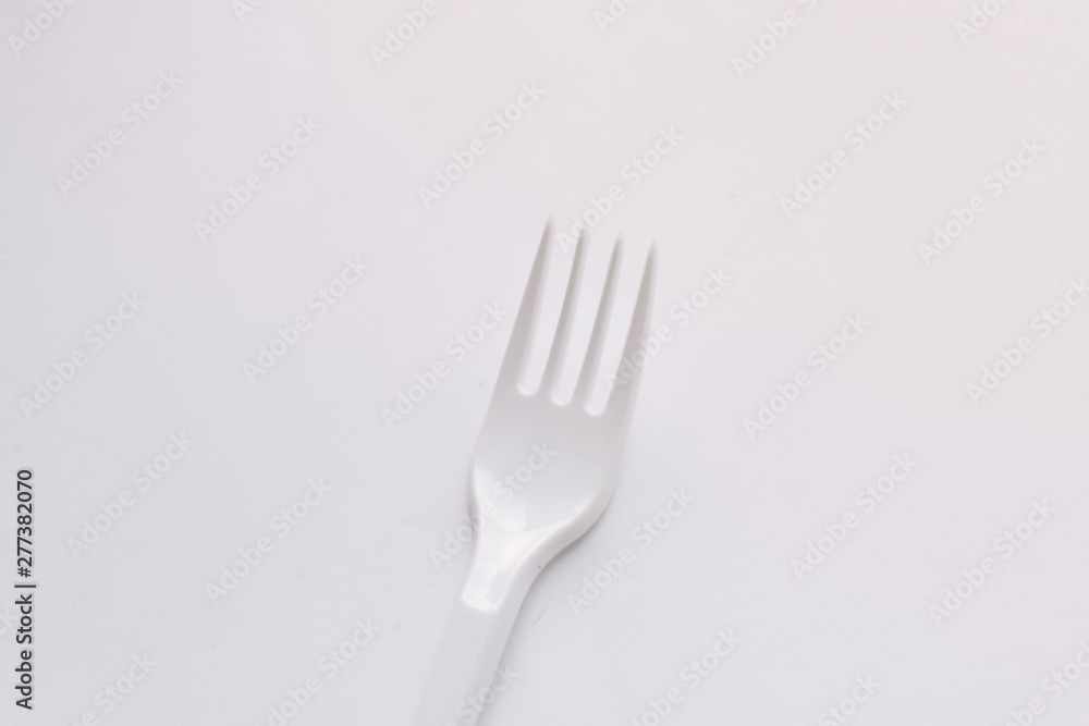 White plastic forks flat lay on white background White plastic forks flat lay on white background