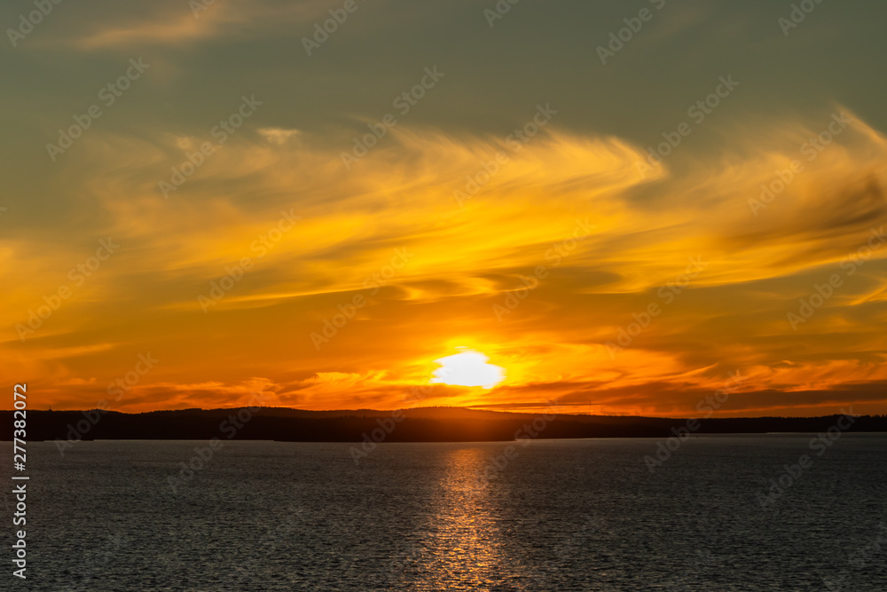 Beautiful sunset with clouds over lake Nasijarvi in Tampere, Finland