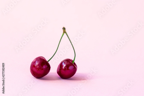 Cherry berry on a pink background