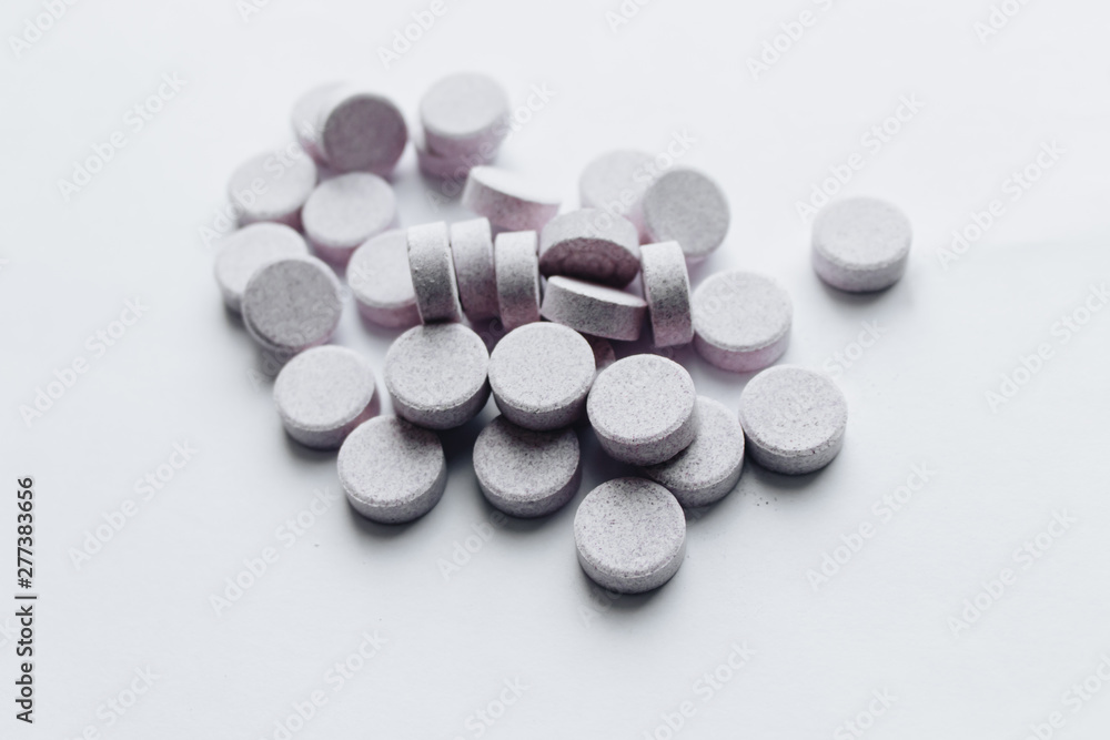 Scatterded pills on white background Scatterded pills on white background