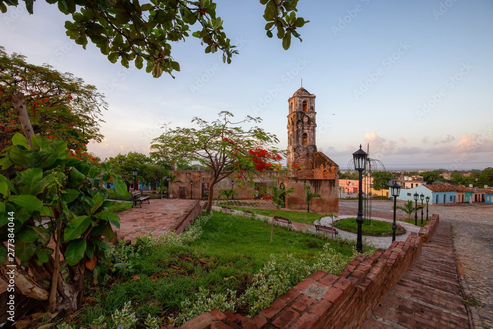 Beautiful View of a Church in a small touristic Cuban Town during a vibrant sunny and cloudy sunrise. Taken in Trinidad, Cuba.