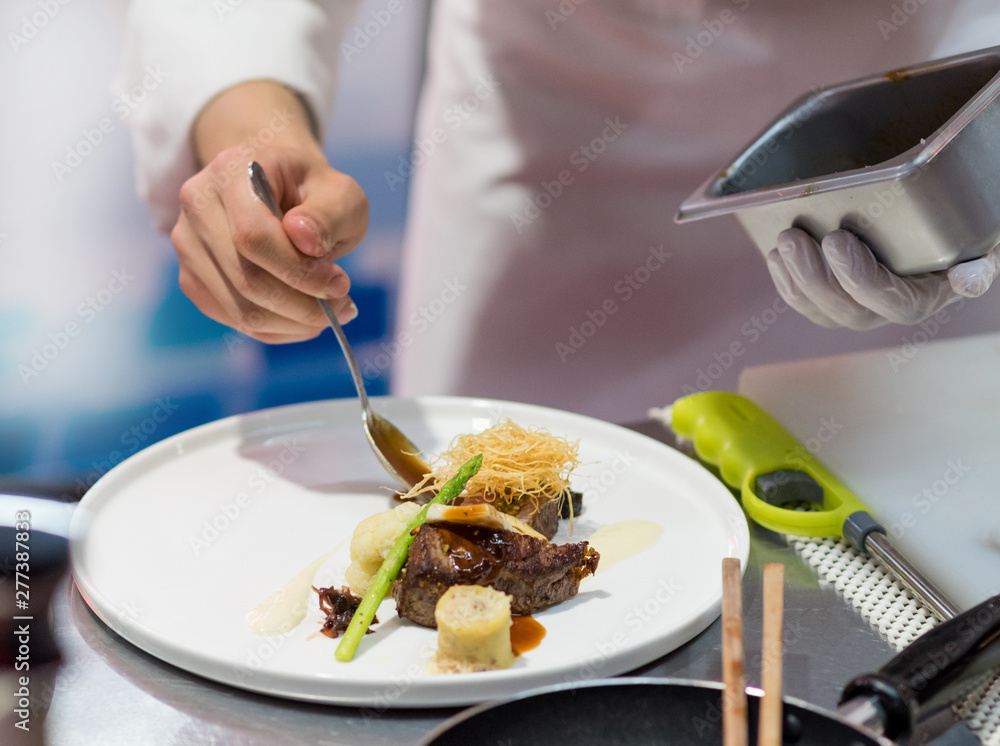 Chef cooking food in the kitchen, Chef preparing food Chef cooking food in the kitchen, Chef preparing food