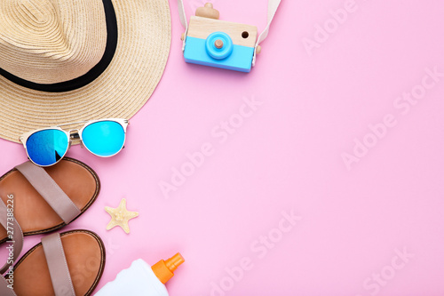 Fashion clothing with sunscreen and starfish on pink background