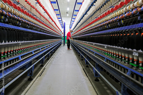 workers are busy at the spinning line, Tangshan City, Hebei, China