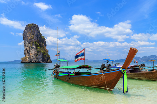 Beautiful crystal clear turquoise blue sea and boats at Ko Poda Island, Ao Phra Nang bay, Krabi, Thailand © wirojsid