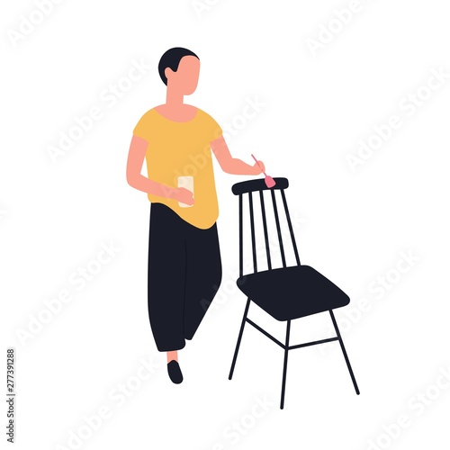 Cute adorable woman painting wooden chair