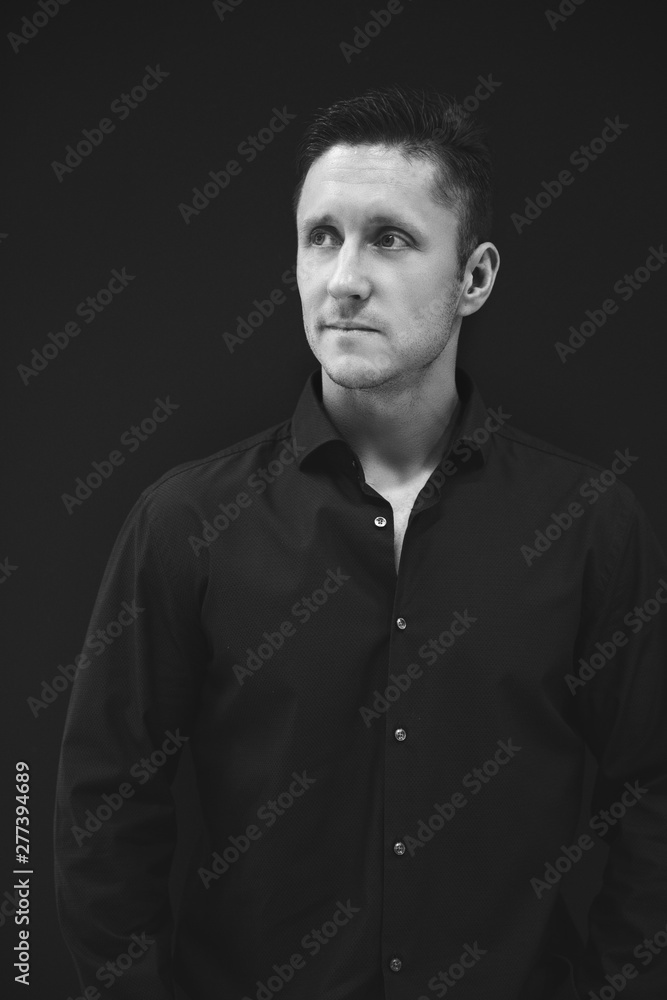 Obraz premium Business man in black shirt portrait