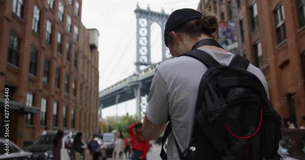 Slo-mo of a Cultured Photographer Taking Beautiful Photographs Of The Iconic Manhattan Bridge in The Beautiful Dumbo Brooklyn In the famous New York City With Tourists Enjoying The City Slo-mo of a Cultured Photographer Taking Beautiful Photographs Of The Iconic Manhattan Bridge in The Beautiful Dumbo Brooklyn In the famous New York City With Tourists Enjoying The City