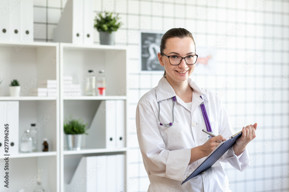Portrait of a veterinarian doctor with a smile. Blurred background of veterinary clinic. Portrait of a veterinarian doctor with a smile. Blurred background of veterinary clinic.