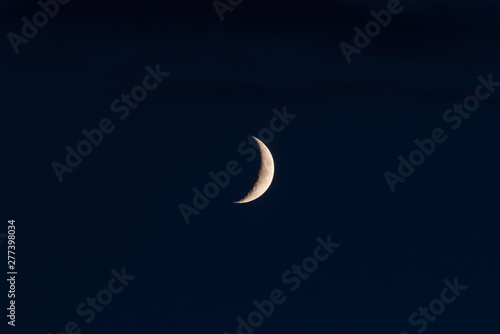 Obraz na płótnie The new moon in the sky on a summer evening w salonie