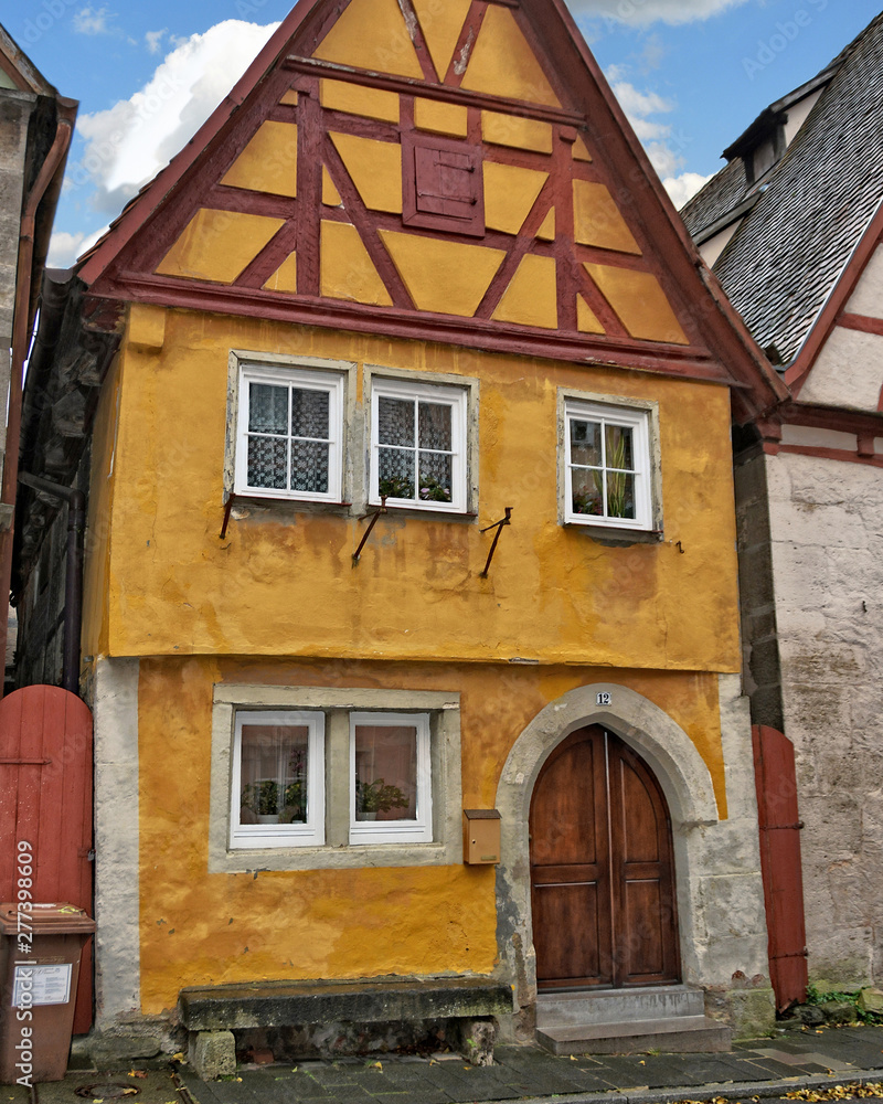 Medieval German architecture. Ancient half-timbered house in unique old town in Bavaria. One of the most attractive towns in Germany. Rothenburg ob der Tauber  – November 22, 2017