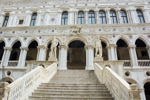 The architecture of the Doge's Palace from the courtyard: stairs and sculptures, Venice, Italy.