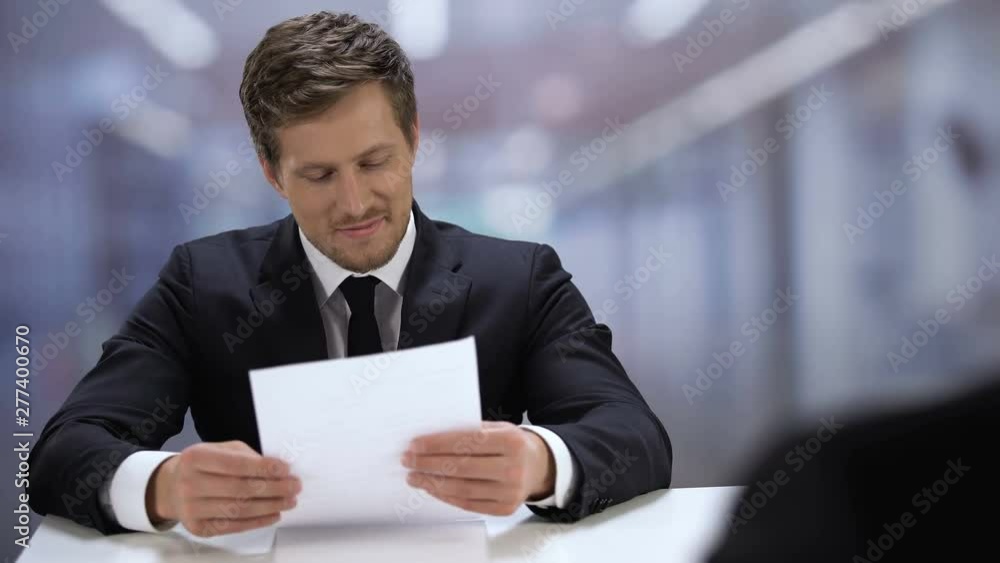 Pleased job applicant taking positive test result, shaking boss hand employment Pleased job applicant taking positive test result, shaking boss hand employment