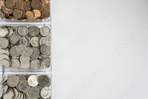 Organized loose coin change on left side, blank empty room space for text right