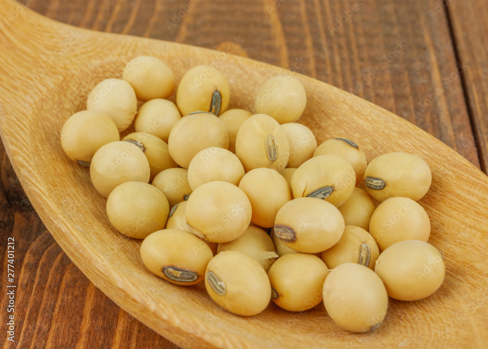 Close up,macro soybeans in  wooden spoon