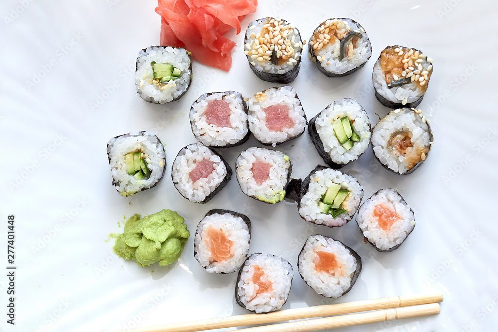 Sushi set. Set of different sushi with seafood. Sushi rolls with different fillings. A dish of traditional Japanese cuisine. Rolls with a variety of seafood. Rolls with oceanic fish and vegetables. Sushi set. Set of different sushi with seafood. Sushi rolls with different fillings. A dish of traditional Japanese cuisine. Rolls with a variety of seafood. Rolls with oceanic fish and vegetables.