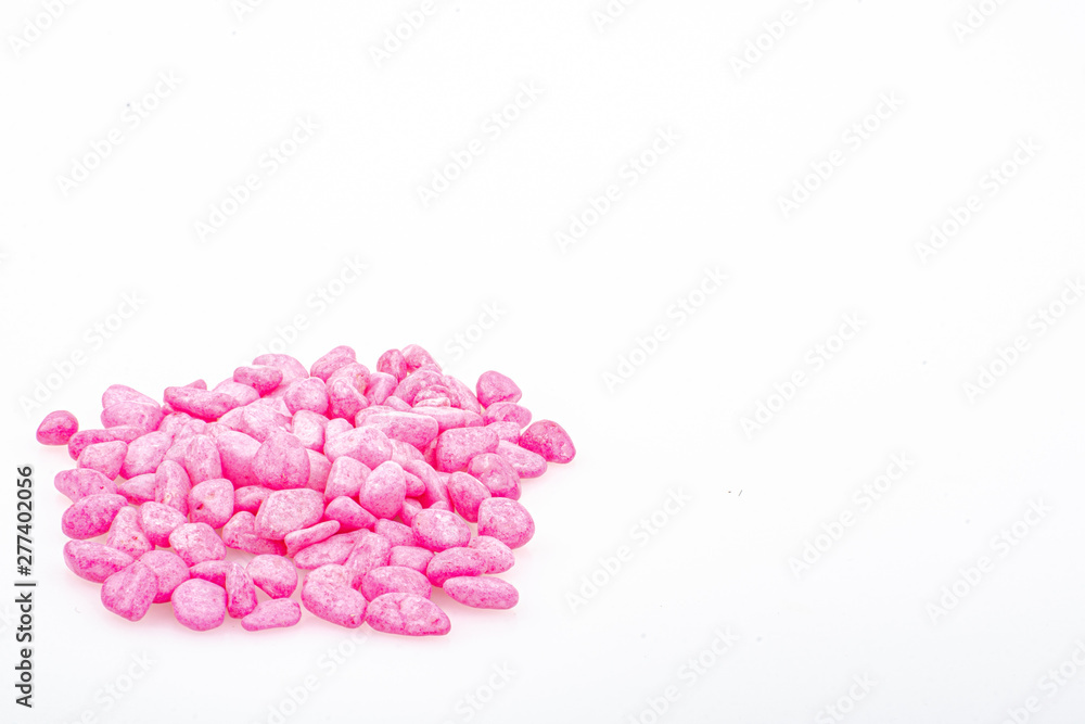 Pink pebbles stone with empty copyspace area for slogan or advertising text message, over isolated white background. Pink pebbles stone with empty copyspace area for slogan or advertising text message, over isolated white background.