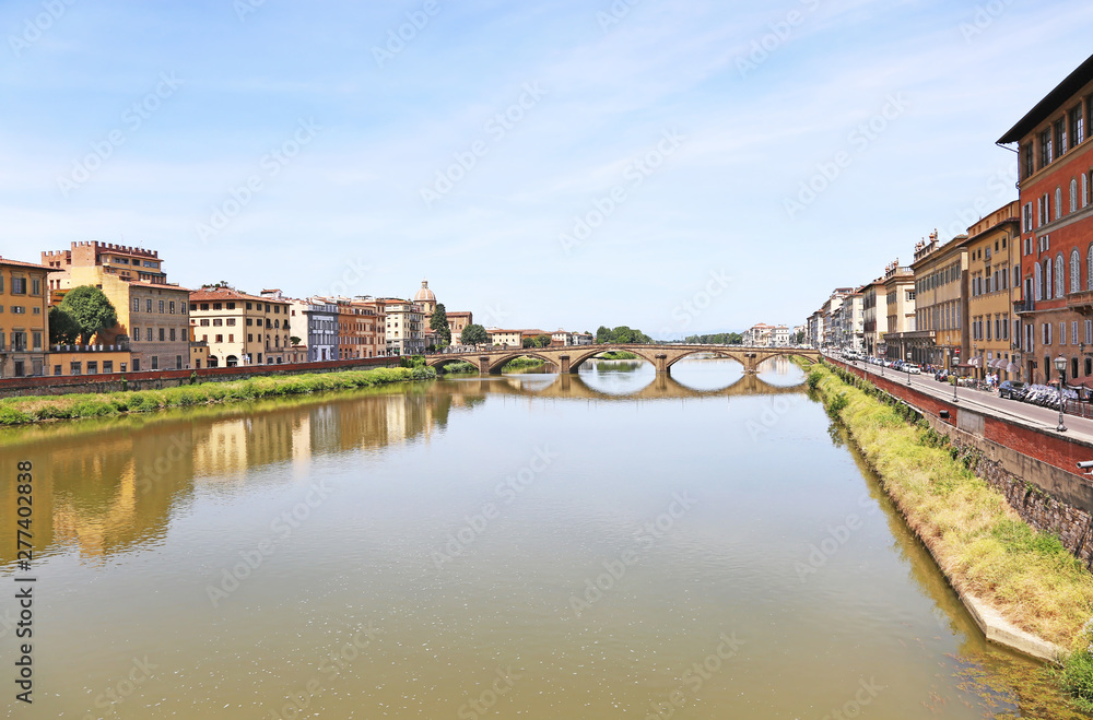 scenery of Florence or Firenze city Italy - buildings reflected on Arno river