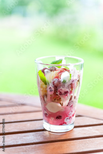 Vanilla and strawberry ice cream with fresh fruits