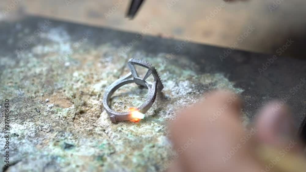 craftsman rings production white gold ring. welding the diamond ring close up craftsman rings production white gold ring. welding the diamond ring close up