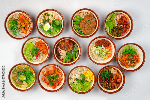 Top view at assortment of tasty and fresh samples Chinese noodles soups with meat and vegetables.