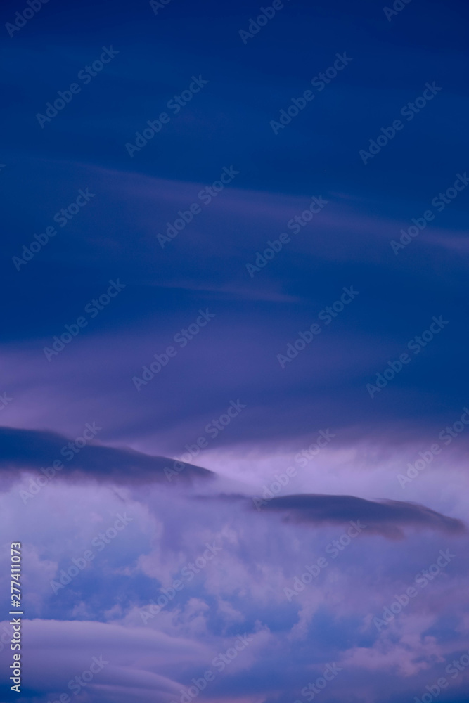 dark blue clouds on pink from sunset sky dark blue clouds on pink from sunset sky