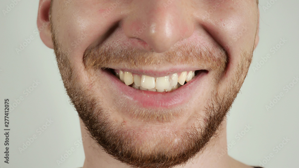 Obraz premium close up face unrecognizable man without eyes smiling. caucasian male with beard laughing