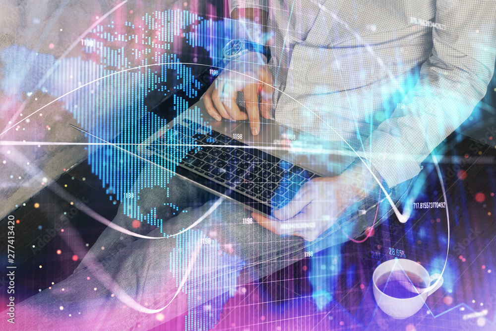 Double exposure of businessman working on laptop on background. International business hologram in front. Concept of success. Double exposure of businessman working on laptop on background. International business hologram in front. Concept of success.