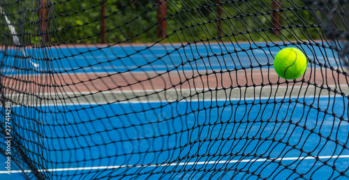 Tennis ball hitting on the net © Dmitry