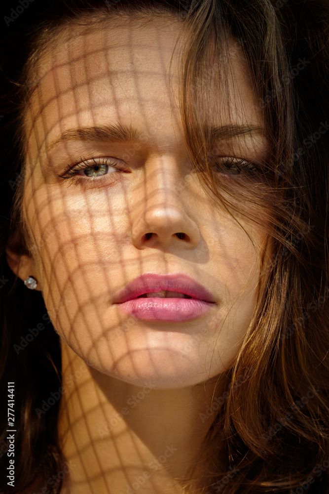 Fototapeta premium Closeup portrait of attractive young female