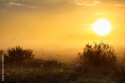 beautiful autumn landscape with sunrise and fog. panoramic view of sky and su...