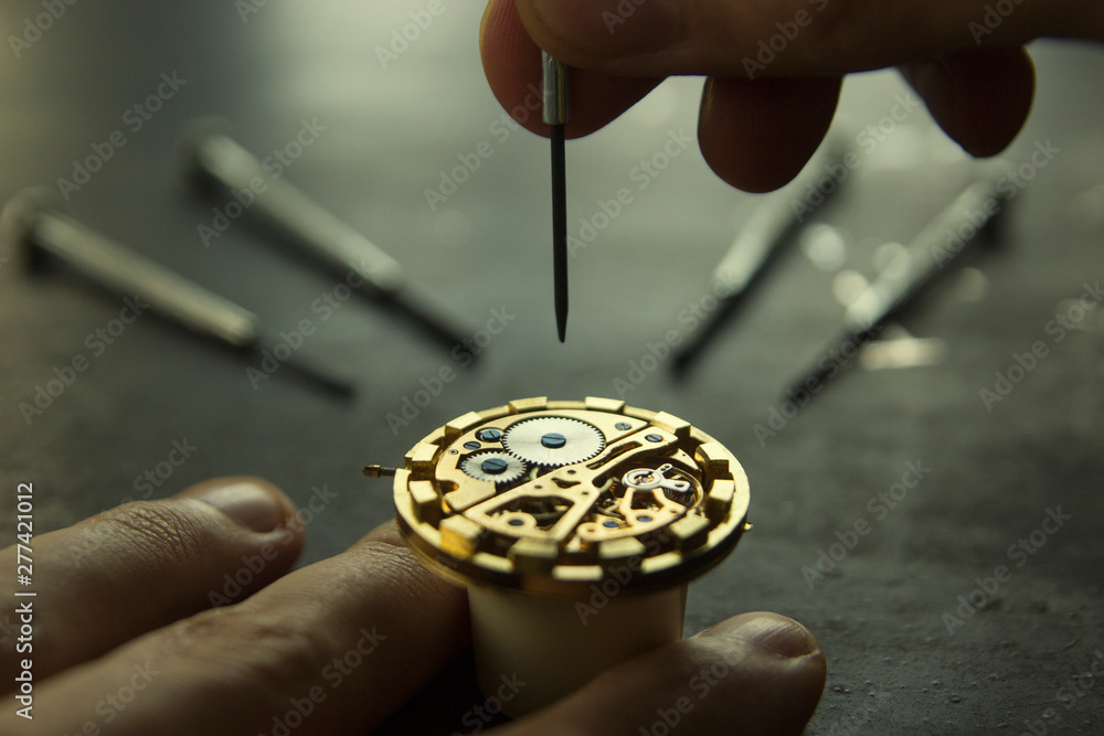 Watchmaker is repairing the wristwatch, mechanical watch Watchmaker is repairing the wristwatch, mechanical watch