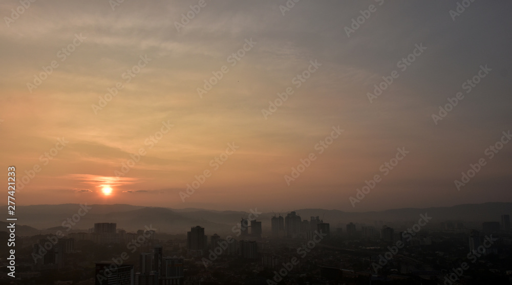 Sun rise over the hills of Kuala Lumpur Sun rise over the hills of Kuala Lumpur