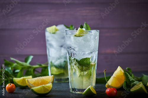 Mojito refreshing summer cocktail. Ingredients: ice, soda, rum, sugar syrup, lime, mint.