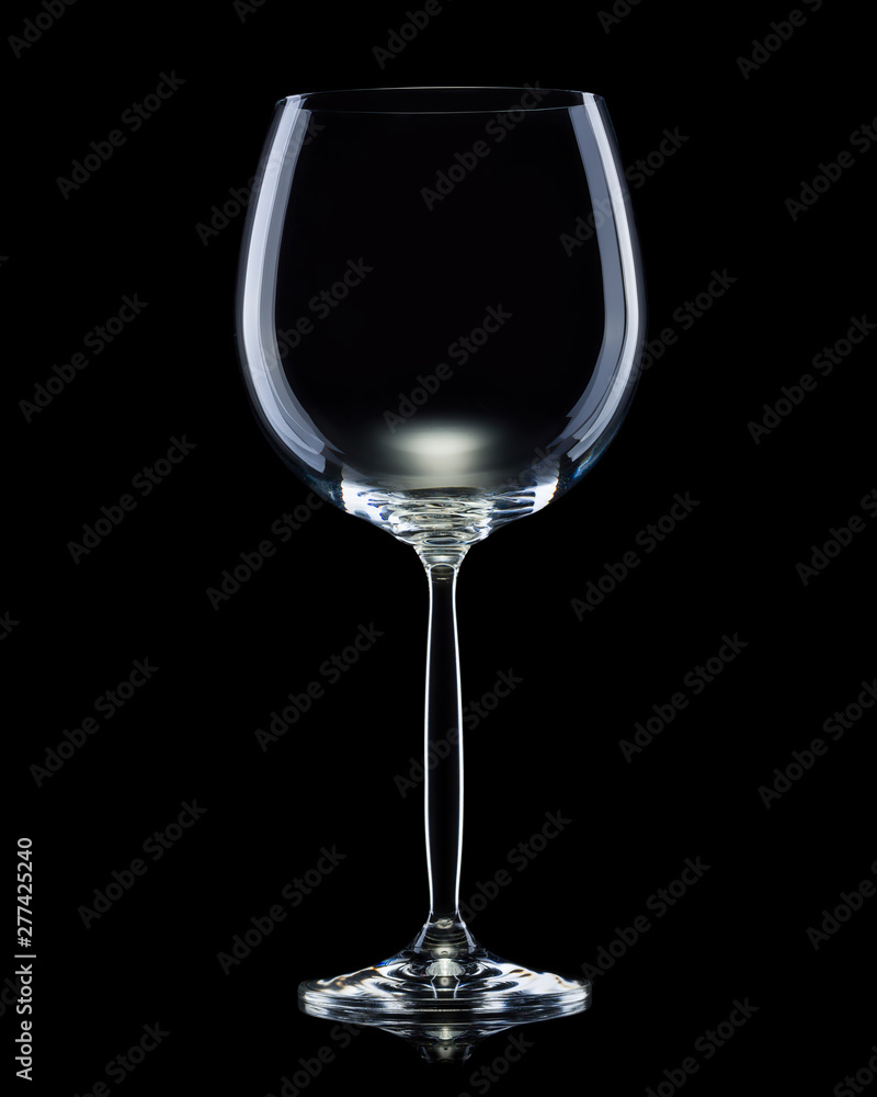 Empty glass for red wine isolated on black background. Empty glass for red wine isolated on black background.