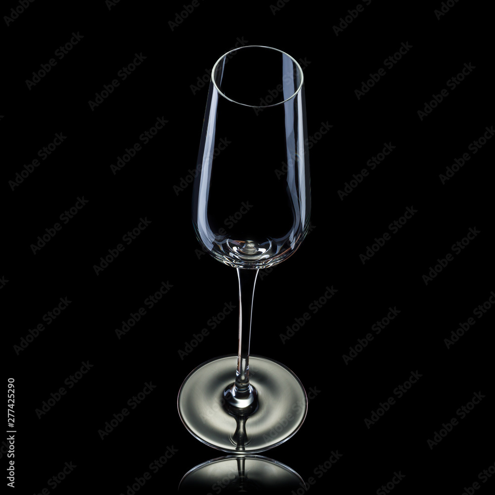 Empty luxury champagne glass isolated on a black background Empty luxury champagne glass isolated on a black background