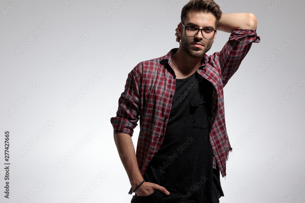 Handsome casual guy posing with his hand in his pocket Handsome casual guy posing with his hand in his pocket