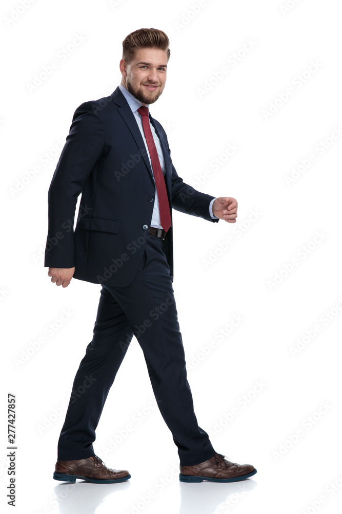 Side view of a confident businessman walking Side view of a confident businessman walking