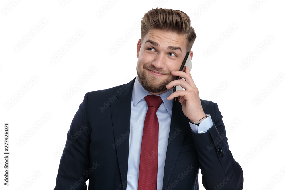 Fashion businessman talking on his phone and smiling Fashion businessman talking on his phone and smiling