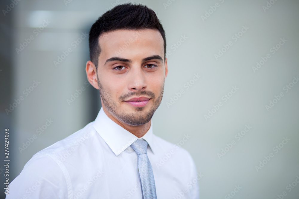 Young businessman outdoor in a modern city setting Young businessman outdoor in a modern city setting