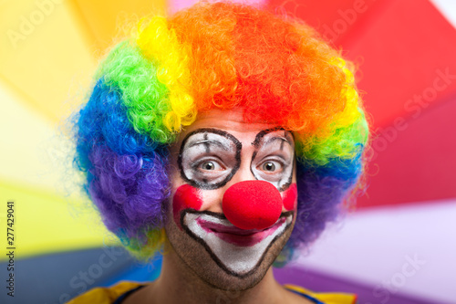 Fototapeta Naklejka Na Ścianę i Meble -  Funny clown in a colorful background