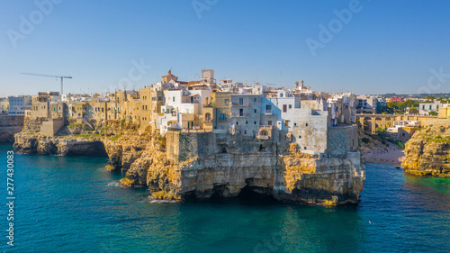 Aerial view of the beach lama monachile cala porto in the italian city polignano a mare.  photo