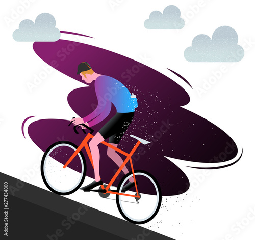 Cyclist riding his bike climbing uphill.
