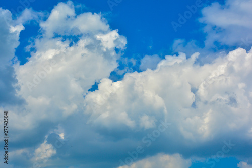 White  Fluffy Clouds In Blue Sky. Background From Clouds.