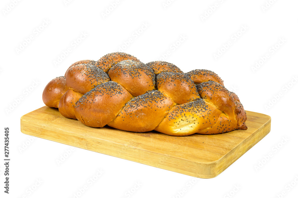 Challah bread on chopping board